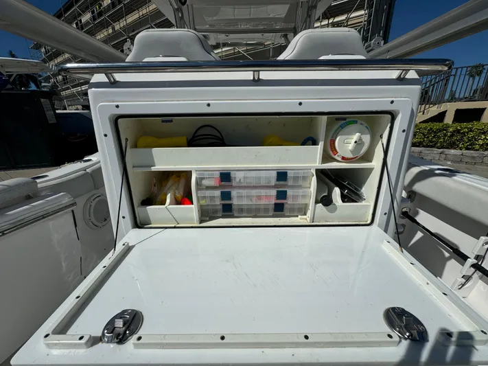  Yacht Photos Pics Storage compartment on a 2020 Sea Fox 288 Commander boat, featuring organized shelves and containers.