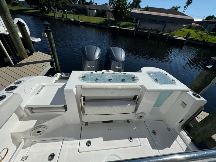  Yacht Photos Pics 2020 Sea Fox 288 Commander boat with dual engines docked by a canal.