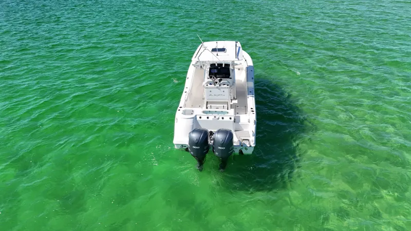  Yacht Photos Pics 2020 Sea Fox 288 Commander boat on clear green water, rear view.