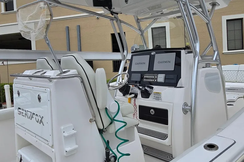  Yacht Photos Pics 2020 Sea Fox 288 Commander boat interior with dual Garmin displays and steering wheel.