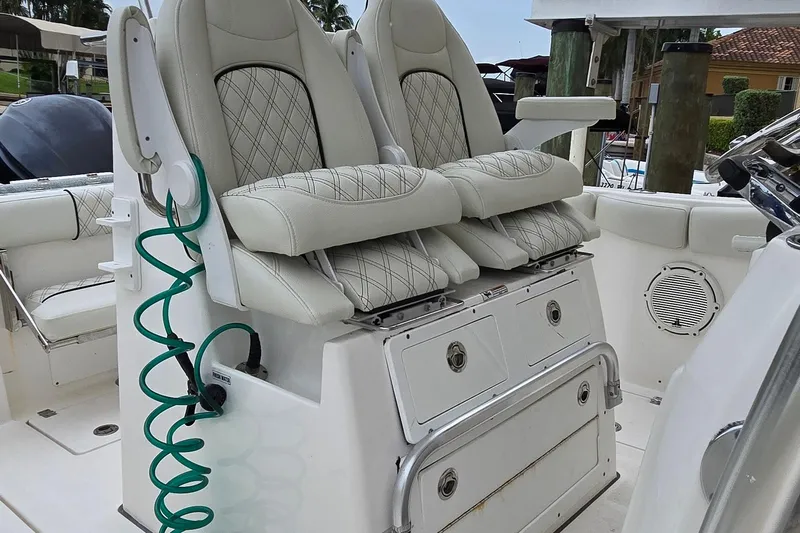  Yacht Photos Pics 2020 Sea Fox 288 Commander boat interior with cushioned seating and storage compartments.