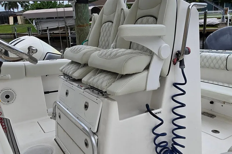  Yacht Photos Pics 2020 Sea Fox 288 Commander boat interior with cushioned seats and storage compartments.