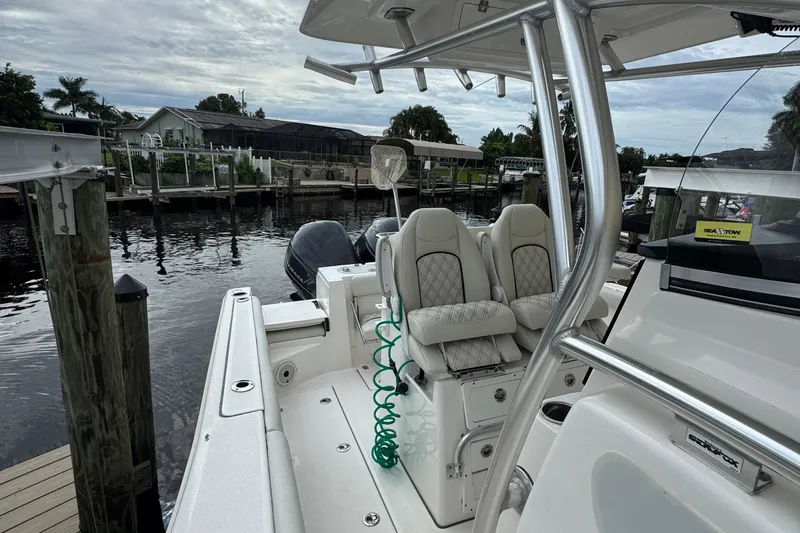  Yacht Photos Pics 2020 Sea Fox 288 Commander boat docked, featuring dual seats and sleek design.