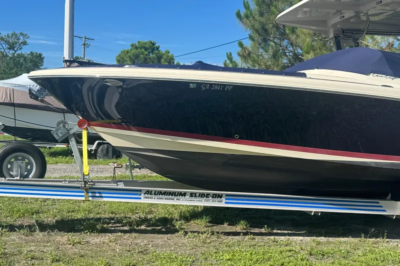  Yacht Photos Pics 2018 Chris-Craft Calypso 30 boat on aluminum trailer, parked outdoors.