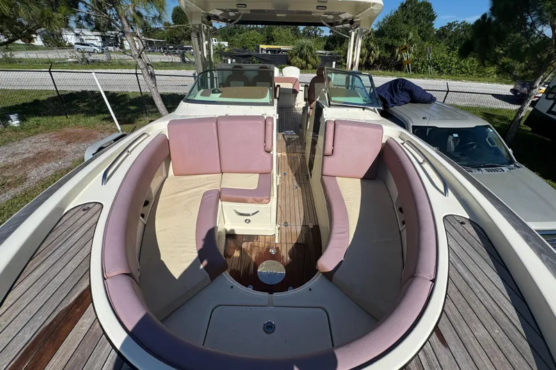  Yacht Photos Pics 2018 Chris-Craft Calypso 30 boat interior with pink seating and wooden deck.