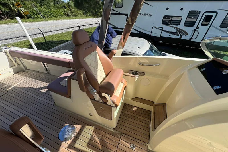  Yacht Photos Pics 2018 Chris-Craft Calypso 30 boat interior with luxurious seating and wooden deck.