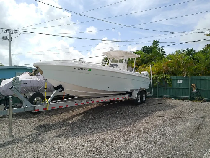 Yacht Photos Pics 2025 Glasstream 328 SCX boat on trailer in outdoor storage area.