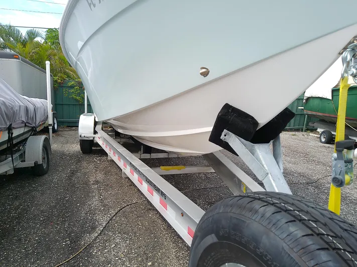  Yacht Photos Pics 2025 Glasstream 328 SCX boat on trailer, parked outdoors.