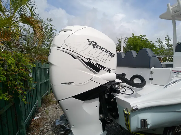  Yacht Photos Pics 2025 Glasstream 328 SCX with Mercury Racing 400 outboard engine, parked outdoors.