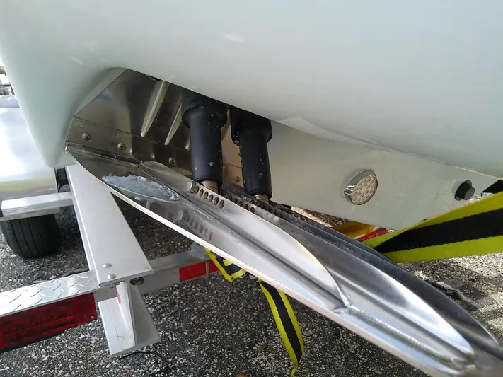  Yacht Photos Pics Close-up of 2025 Glasstream 328 SCX boat's hull and trailer components.