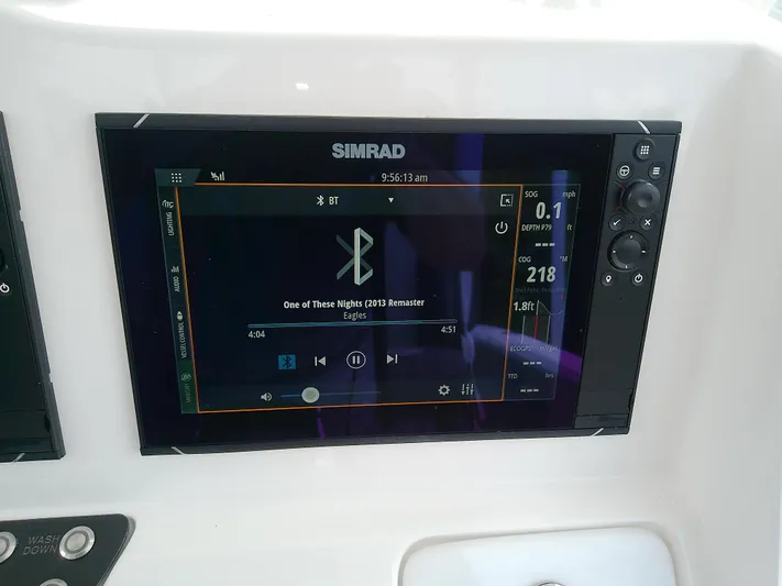  Yacht Photos Pics Simrad display on 2025 Glasstream 328 SCX showing music and navigation data.
