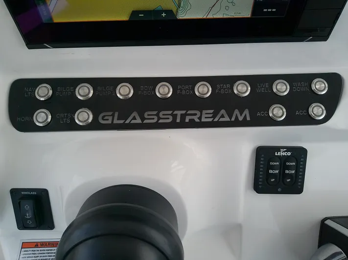  Yacht Photos Pics Control panel of 2025 Glasstream 328 SCX boat with labeled buttons and navigation screen.