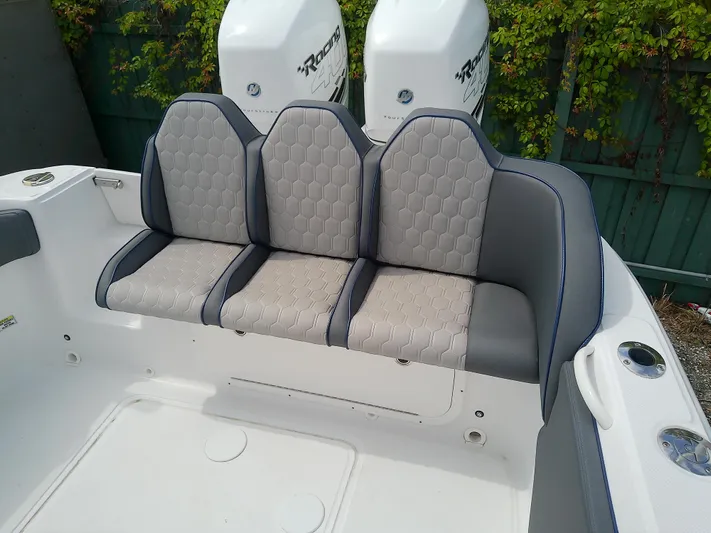  Yacht Photos Pics 2025 Glasstream 328 SCX boat seating with hexagonal pattern and dual outboard motors.