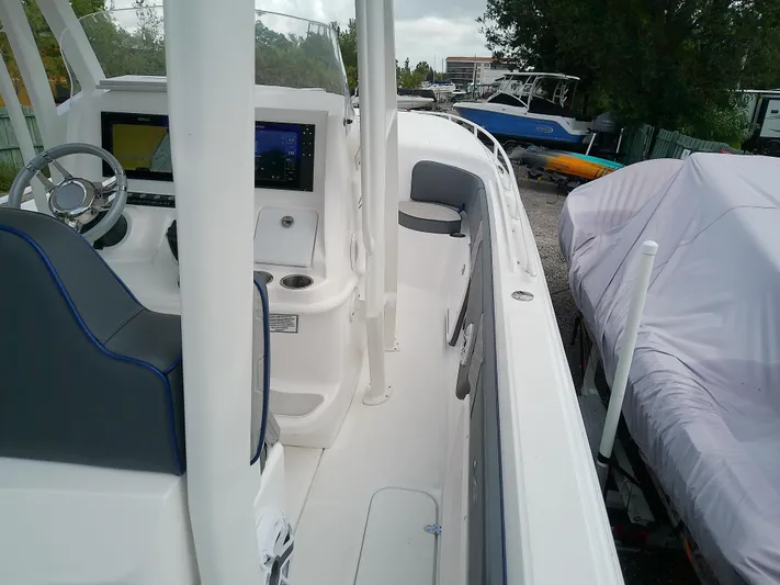  Yacht Photos Pics 2025 Glasstream 328 SCX boat interior with modern dashboard and seating.