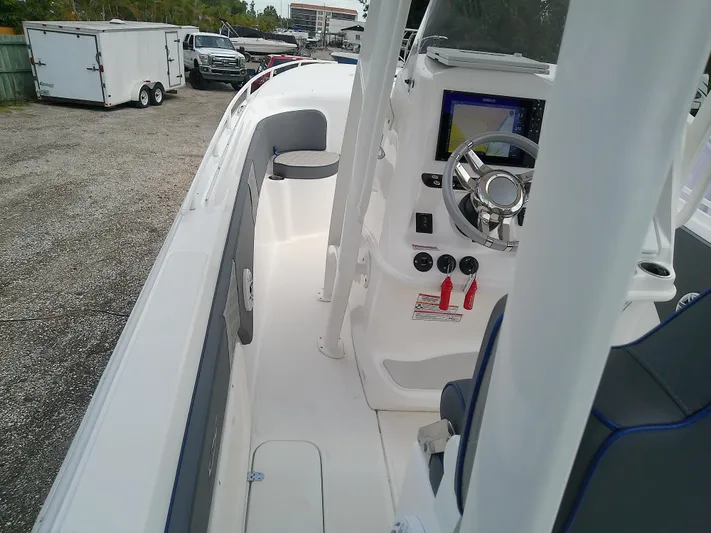  Yacht Photos Pics 2025 Glasstream 328 SCX boat interior with steering console and navigation display.