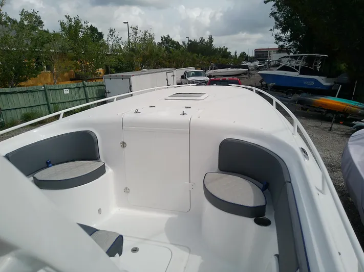  Yacht Photos Pics 2025 Glasstream 328 SCX boat with seating, docked outdoors.