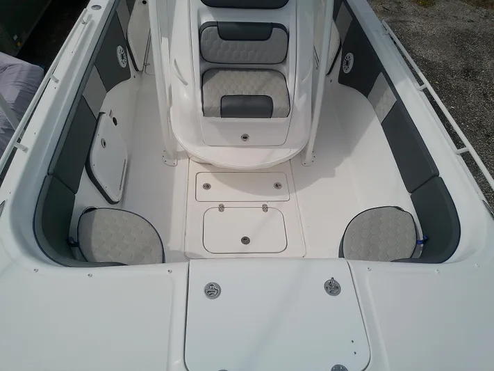  Yacht Photos Pics 2025 Glasstream 328 SCX boat interior with cushioned seating and storage compartments.