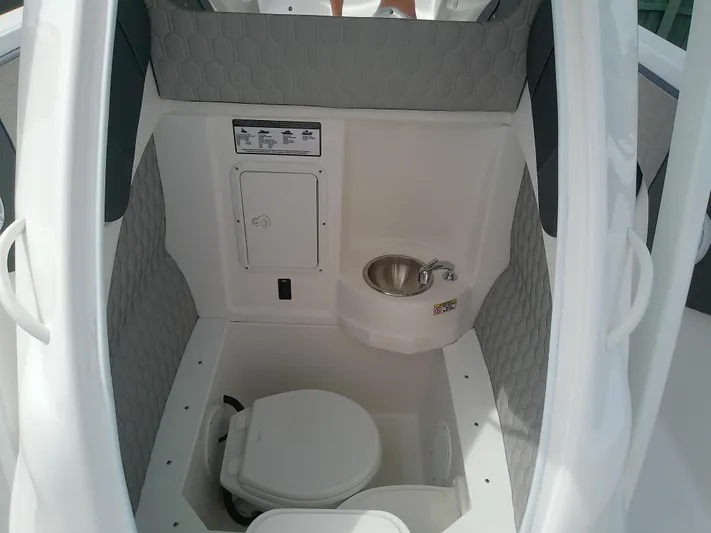  Yacht Photos Pics 2025 Glasstream 328 SCX boat interior with toilet and sink.
