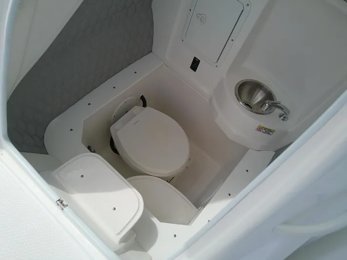 Yacht Photos Pics 2025 Glasstream 328 SCX boat interior with toilet and sink.