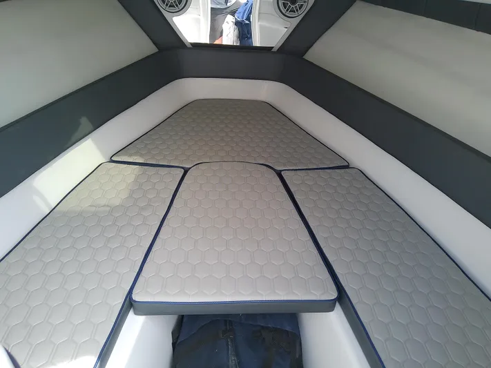  Yacht Photos Pics 2025 Glasstream 328 SCX boat interior with hexagonal-patterned cushions and modern design.