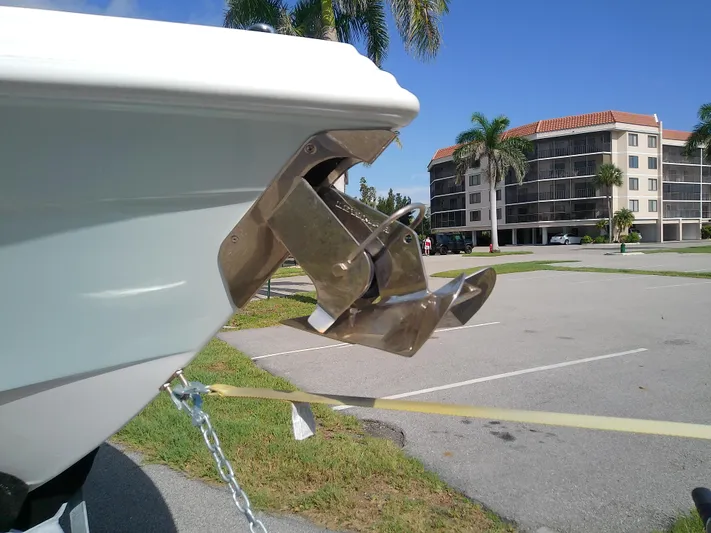  Yacht Photos Pics 2025 Glasstream 328 SCX boat propeller in a parking lot with palm trees.