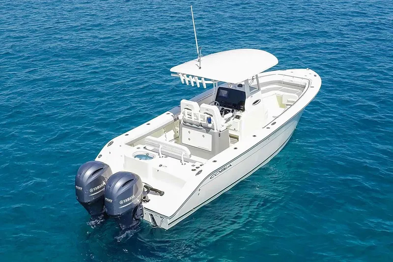  Yacht Photos Pics Manufacturer Provided Image: 2022 Cobia 280 Center Console boat on clear blue water.