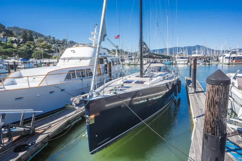 Vie Le Reve Yacht Photos Pics 2013 Hanse 575 yacht docked in a marina under clear blue skies.