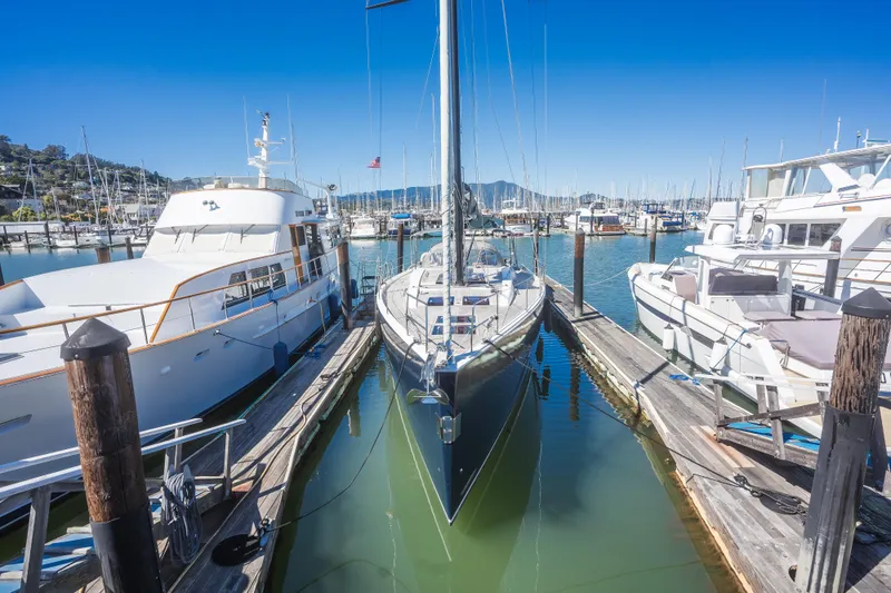 Vie Le Reve Yacht Photos Pics 2013 Hanse 575 yacht docked in a marina, surrounded by other boats.