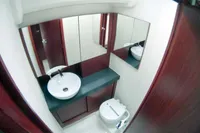 Modern bathroom interior on 2017 Hanse 455 yacht, featuring sink, mirror, and toilet.
