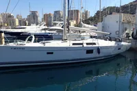 2017 Hanse 455 yacht docked in a marina with cityscape background.
