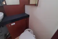 Bathroom interior of 2017 Hanse 455 yacht with toilet and mirror.