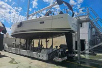 2017 Hanse 455 yacht on a transport platform under a bright blue sky.