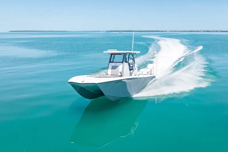  Yacht Photos Pics 2022 Costa Custom Boats 264 cruising on clear turquoise waters.