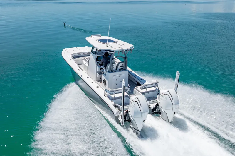  Yacht Photos Pics 2022 Costa Custom Boats 264 cruising on clear blue water, showcasing powerful dual engines.