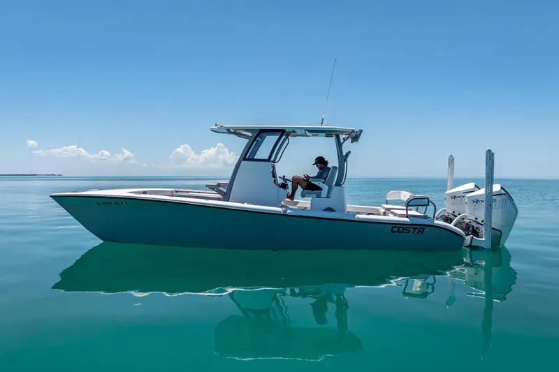  Yacht Photos Pics 2022 Costa Custom Boats 264 on calm blue water, side view.