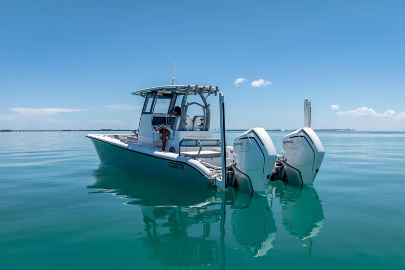  Yacht Photos Pics 2022 Costa Custom Boats 264 on calm blue water with dual engines.