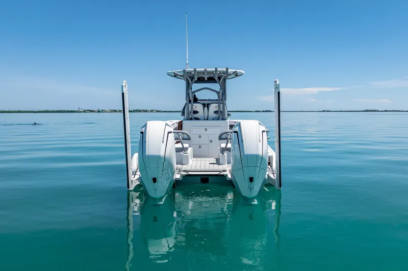  Yacht Photos Pics 2022 Costa Custom Boats 264 on calm blue water, rear view.