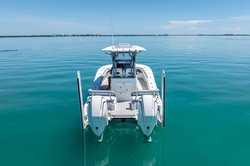  Yacht Photos Pics 2022 Costa Custom Boats 264 on calm turquoise water, rear view.