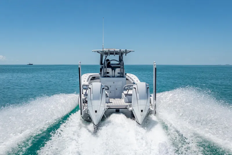  Yacht Photos Pics 2022 Costa Custom Boats 264 cruising on open water, rear view.