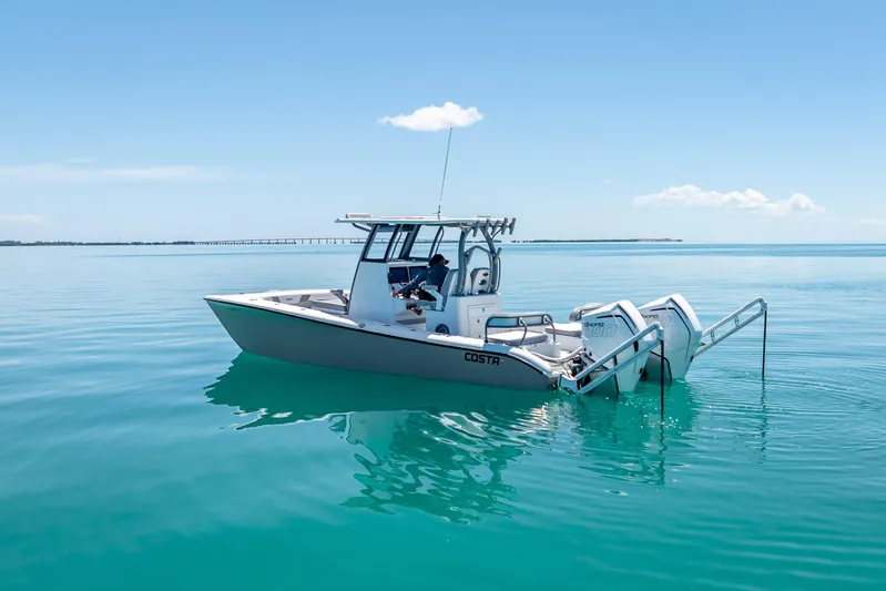  Yacht Photos Pics 2022 Costa Custom Boats 264 on calm turquoise water under clear blue sky.