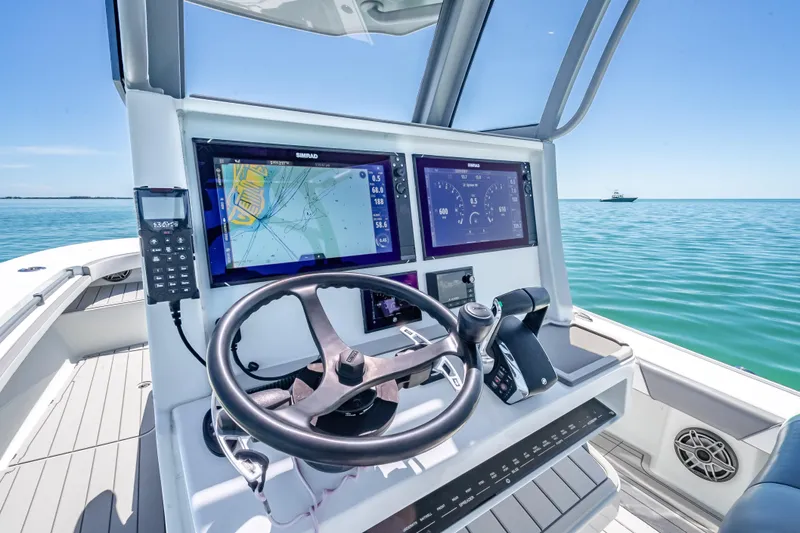  Yacht Photos Pics 2022 Costa Custom Boats 264 helm with advanced navigation system on open water.