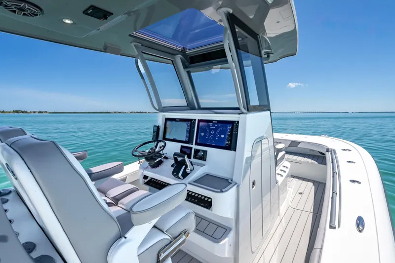  Yacht Photos Pics 2022 Costa Custom Boats 264 helm with advanced navigation, sleek design, and ocean view.