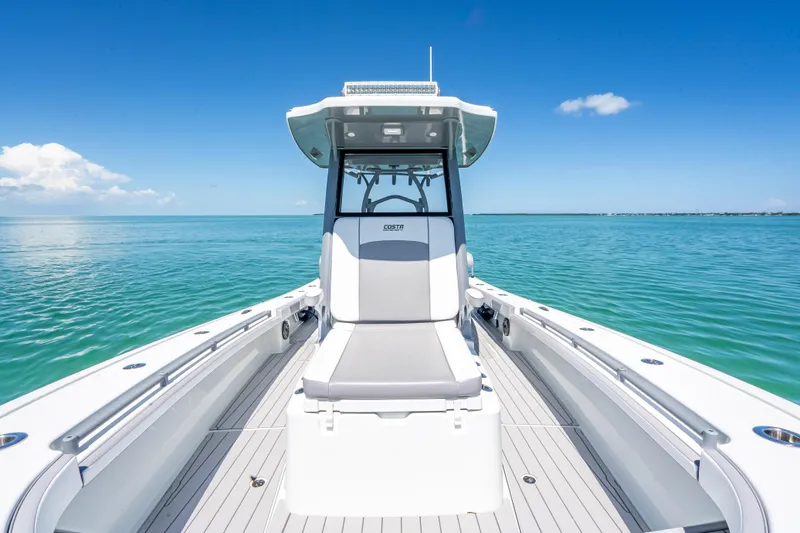  Yacht Photos Pics 2022 Costa Custom Boats 264 on calm ocean, showcasing sleek design and spacious deck.