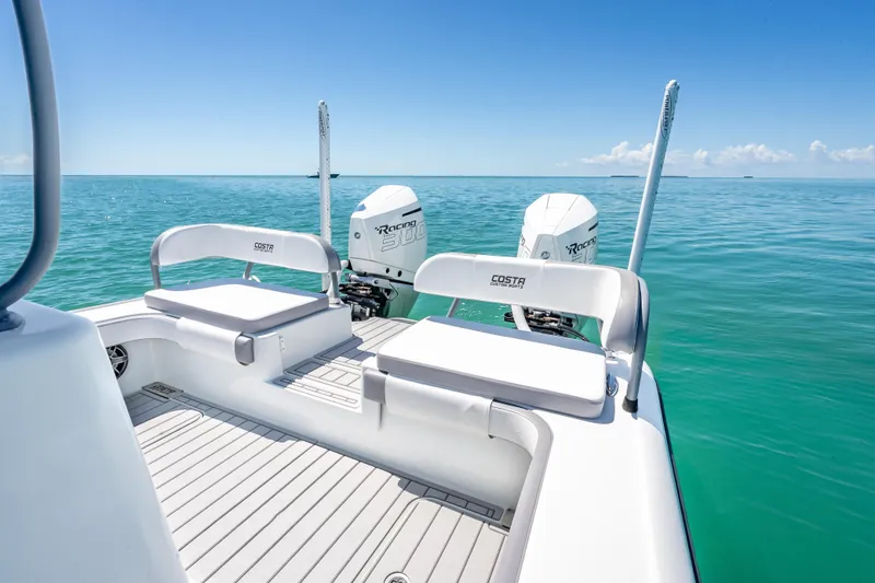  Yacht Photos Pics 2022 Costa Custom Boats 264 on serene ocean, featuring dual engines and sleek seating.