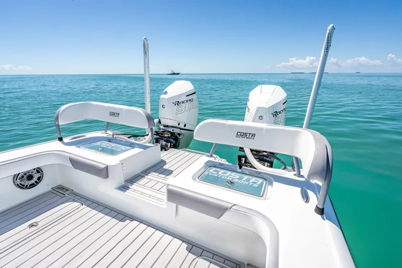  Yacht Photos Pics 2022 Costa Custom Boats 264 on clear blue ocean with twin Racing 300 engines.