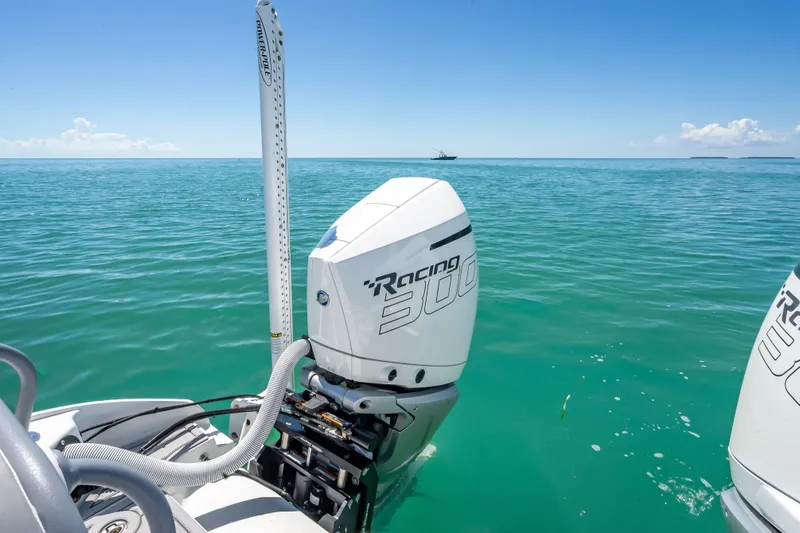  Yacht Photos Pics Costa Custom Boats 264, 2022 model, with powerful outboard motor on turquoise sea.