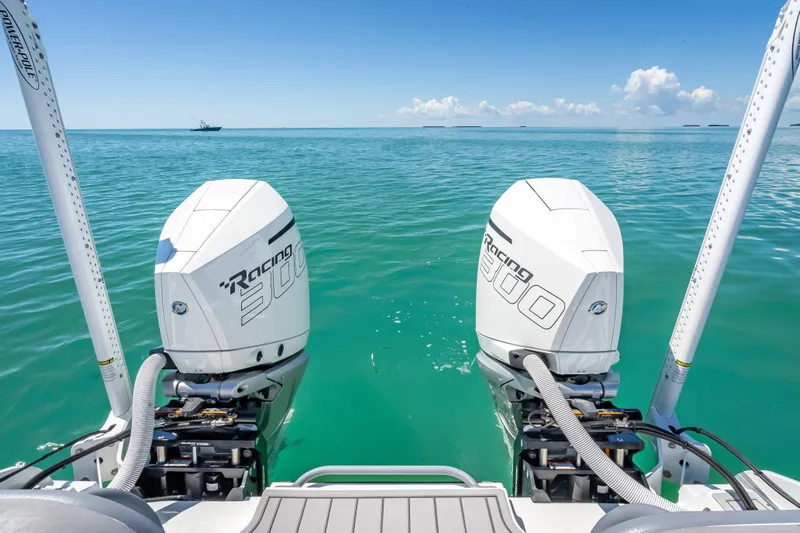  Yacht Photos Pics 2022 Costa Custom Boats 264 with twin Racing 300 engines on turquoise water.