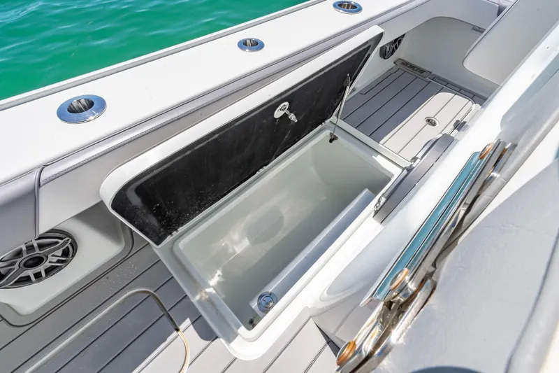  Yacht Photos Pics Open storage compartment on 2022 Costa Custom Boats 264, with sleek deck design and ocean view.