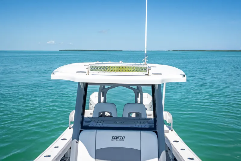  Yacht Photos Pics 2022 Costa Custom Boats 264 on serene blue ocean waters.