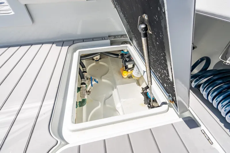 Yacht Photos Pics Open hatch on 2022 Costa Custom Boats 264, revealing internal components and storage.